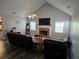 Spacious living room features vaulted ceiling, fireplace, plank flooring, and plenty of natural light at 4045 Fawn Valley Dr, Loganville, GA 30052