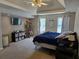 Comfortable main bedroom with trey ceiling, fan, and ample space for relaxation at 4045 Fawn Valley Dr, Loganville, GA 30052