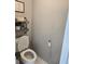 Cozy powder room with decorative shelving and neutral wall color at 4045 Fawn Valley Dr, Loganville, GA 30052