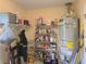 Organized utility room with water heater, shelving, and storage solutions for household needs at 4045 Fawn Valley Dr, Loganville, GA 30052