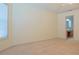 Spacious bedroom with neutral carpet, light walls and entrance to the primary ensuite bathroom at 1166 Memory Ln, Lawrenceville, GA 30044