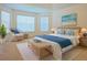 Bedroom with bright light from windows and wicker furniture providing a relaxing coastal aesthetic at 1166 Memory Ln, Lawrenceville, GA 30044