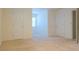 Spacious bedroom with neutral carpet and a window with blinds for plenty of natural light at 1166 Memory Ln, Lawrenceville, GA 30044