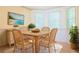 Sunlit dining area features a table, seating for four, and natural light at 1166 Memory Ln, Lawrenceville, GA 30044