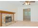 Spacious living room with stone fireplace and large opening to the adjacent room at 1166 Memory Ln, Lawrenceville, GA 30044