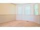 Bright, sunny room with chair rail, carpeted floors, and natural light at 1166 Memory Ln, Lawrenceville, GA 30044