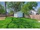 Green backyard with lush lawn, a shed and a wooden fence, providing a private outdoor space at 1292 Eubanks Ave, Atlanta, GA 30344