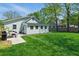 Spacious backyard featuring lush green lawn, a picnic table, and a well-maintained green home at 1292 Eubanks Ave, Atlanta, GA 30344