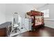 Cozy bedroom with a bunk bed, dark wood floors, and a full-length mirror at 1292 Eubanks Ave, Atlanta, GA 30344