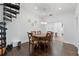 Bright dining area with a wooden table, chairs, and access to a spiral staircase at 1292 Eubanks Ave, Atlanta, GA 30344