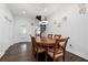 Elegant dining room featuring a wooden table, spiral staircase, and natural light at 1292 Eubanks Ave, Atlanta, GA 30344