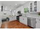 Stylish kitchen with white cabinetry, stainless steel appliances, and an open view to the living area at 1292 Eubanks Ave, Atlanta, GA 30344