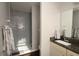 Modern bathroom featuring glass enclosed shower and stylish granite vanity at 2218 Edgemore Se Dr, Atlanta, GA 30316