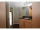 Bathroom features granite countertop, wooden cabinets and view to bedroom at 2218 Edgemore Se Dr, Atlanta, GA 30316