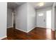 Bright foyer featuring hardwood flooring and a white front door with glass accents, offering a welcoming entrance at 2218 Edgemore Se Dr, Atlanta, GA 30316