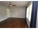 The bright living room features hardwood floors, a ceiling fan, and large windows at 2218 Edgemore Se Dr, Atlanta, GA 30316