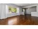 Spacious living room with hardwood floors, big windows and open to the dining room at 2218 Edgemore Se Dr, Atlanta, GA 30316