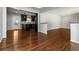 Open living space with hardwood floors, connecting the living room to the modern kitchen at 2218 Edgemore Se Dr, Atlanta, GA 30316