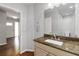 Conveniently located powder room with stylish granite vanity and modern fixtures at 2218 Edgemore Se Dr, Atlanta, GA 30316