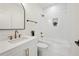 Stylish bathroom with a shower over the tub and sleek fixtures, combining elegance and functionality at 224 Cambridge Ave, Decatur, GA 30030