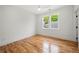 Cozy bedroom featuring hardwood floors and natural light from large windows at 224 Cambridge Ave, Decatur, GA 30030