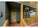 Charming front porch with wooden railings, hanging plants, and a cozy seating area at 224 Cambridge Ave, Decatur, GA 30030