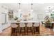 Modern kitchen features white cabinets, a large island with seating, and stylish pendant lighting at 224 Cambridge Ave, Decatur, GA 30030