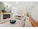 Elegant living room with a fireplace, hardwood floors, and comfortable seating at 224 Cambridge Ave, Decatur, GA 30030