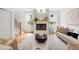 Cozy living room with a fireplace, neutral-toned furniture, and abundant natural light at 224 Cambridge Ave, Decatur, GA 30030