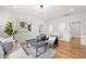 Bright living area features stylish furniture, hardwood floors, and access to other rooms in the house at 224 Cambridge Ave, Decatur, GA 30030