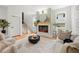 Inviting living room featuring a fireplace, neutral decor, and a comfortable seating arrangement at 224 Cambridge Ave, Decatur, GA 30030