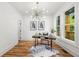Bright home office featuring modern lighting, a spacious desk, and a great view out to the porch at 224 Cambridge Ave, Decatur, GA 30030