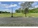 Backyard showcasing a well-maintained lawn and mature trees at 86 Ewing Way, Dacula, GA 30019