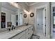 Bathroom showcasing a double vanity with granite countertops and modern fixtures at 86 Ewing Way, Dacula, GA 30019