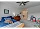 Cozy bedroom with a ceiling fan and a neutral color scheme, ideal for relaxation at 86 Ewing Way, Dacula, GA 30019