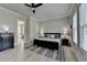 Comfortable bedroom with a large bed, a rug, and two windows allowing for natural light at 86 Ewing Way, Dacula, GA 30019