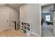 Hallway with hardwood floors leading into a room at 86 Ewing Way, Dacula, GA 30019