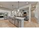 Open concept kitchen with a central island, stainless steel appliances, and view to the living room at 86 Ewing Way, Dacula, GA 30019