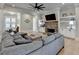 Comfortable living room offers an inviting atmosphere with a fireplace and built in shelves with stylish hardwood floors at 86 Ewing Way, Dacula, GA 30019