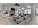 Spacious living room features a brick fireplace flanked by built-in shelves, and large windows overlooking the backyard at 86 Ewing Way, Dacula, GA 30019