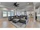 Open-concept living room flows into a modern kitchen, complemented by hardwood floors and comfortable, stylish decor at 86 Ewing Way, Dacula, GA 30019