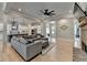 Relaxing living room with a fireplace flows into a modern kitchen creating a welcoming space for relaxation and entertainment at 86 Ewing Way, Dacula, GA 30019