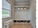 Well-organized mudroom with storage bench, hooks, and shelves for entryway essentials at 86 Ewing Way, Dacula, GA 30019