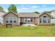 Expansive backyard featuring a cozy patio, lush lawn, and ample space for outdoor recreation at 2416 Centennial Hill Nw Way, Acworth, GA 30102