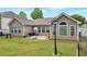 Home featuring a flat backyard with a patio and a basketball hoop at 2416 Centennial Hill Nw Way, Acworth, GA 30102