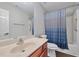 Bathroom featuring a vanity with a sink, a toilet, and a shower/tub combo with a shower curtain at 2416 Centennial Hill Nw Way, Acworth, GA 30102