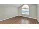 Bedroom featuring hardwood floors, neutral walls, and a large window at 2416 Centennial Hill Nw Way, Acworth, GA 30102