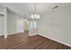 Dining room featuring hardwood floors, modern lighting, and easy access to the kitchen at 2416 Centennial Hill Nw Way, Acworth, GA 30102