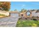Charming single-story home featuring brick accents, manicured landscaping, and attached two-car garage at 2416 Centennial Hill Nw Way, Acworth, GA 30102