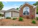 Beautiful brick home with a well-manicured lawn and a detached garage with beautiful landscaping at 2416 Centennial Hill Nw Way, Acworth, GA 30102